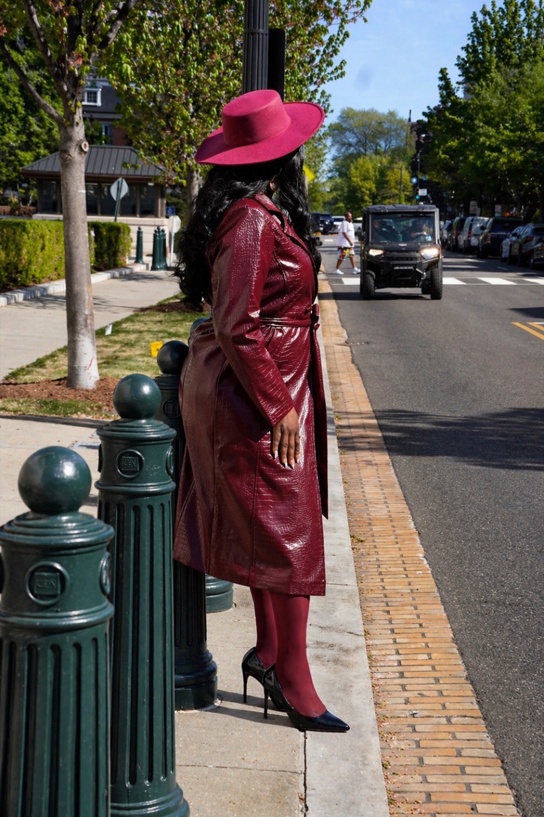 Lifestyle portrait in burgundy trench coat