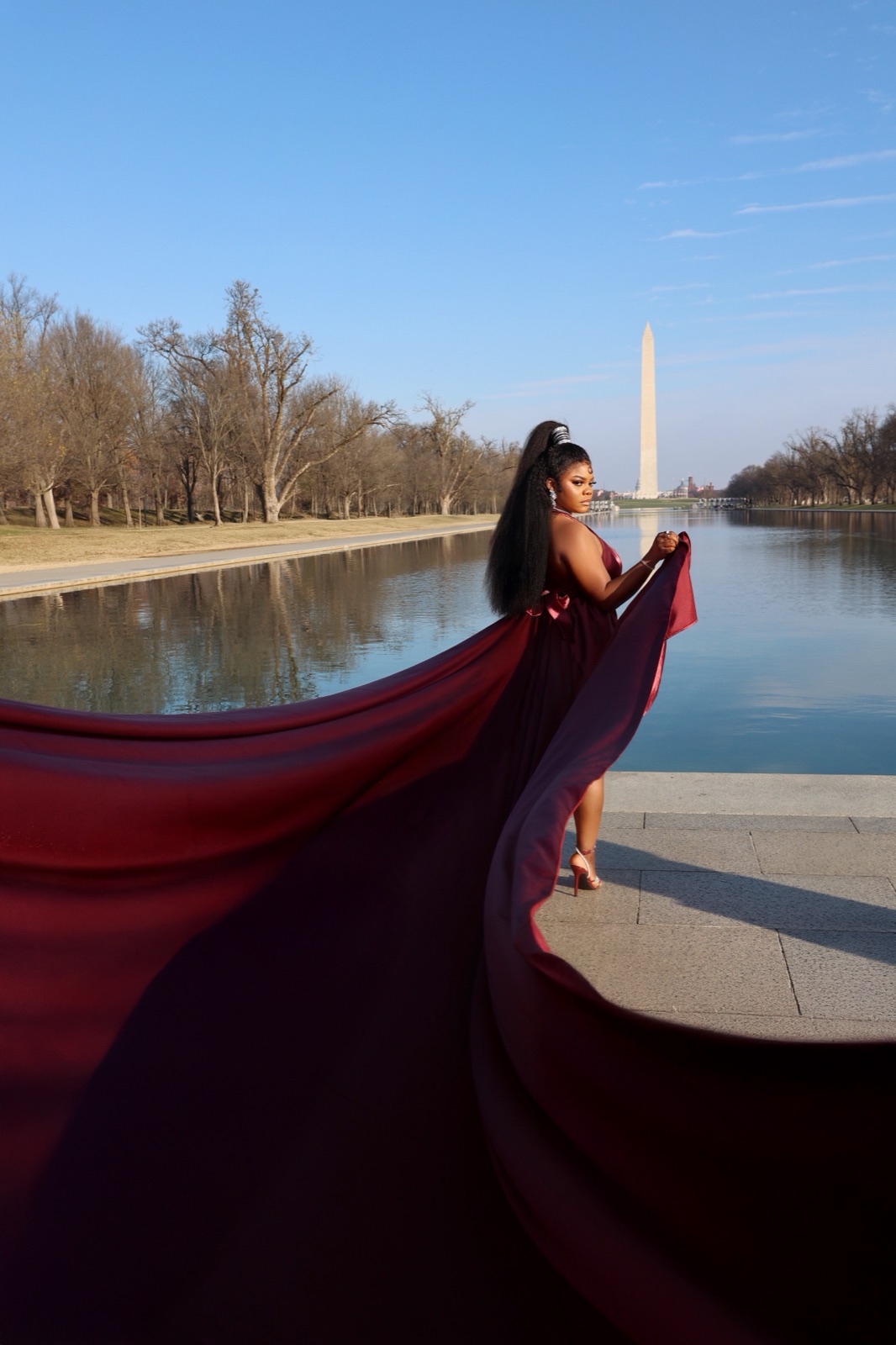 Flowing burgundy gown at the Washington Monument