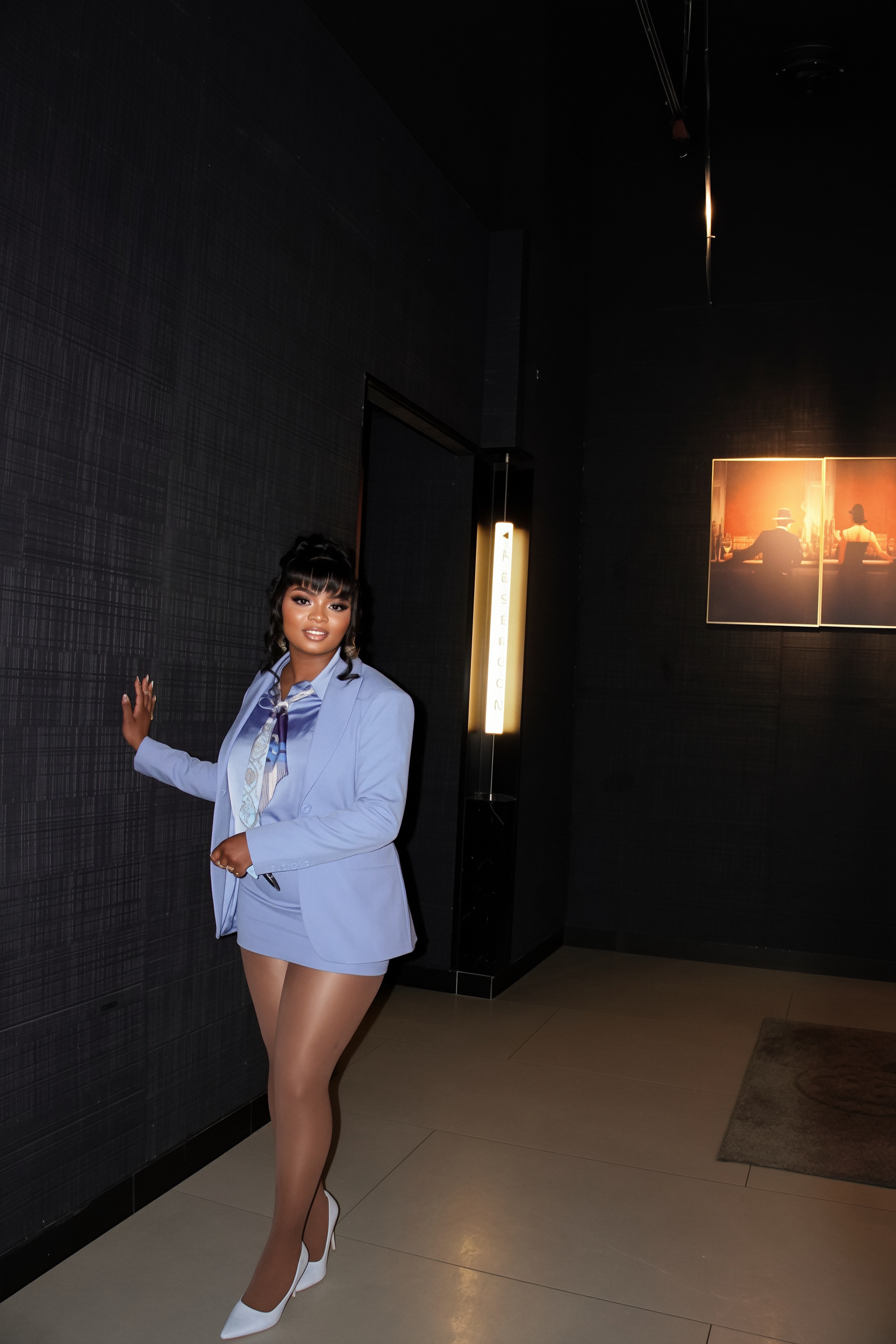 Powder blue lifestyle portrait in corridor